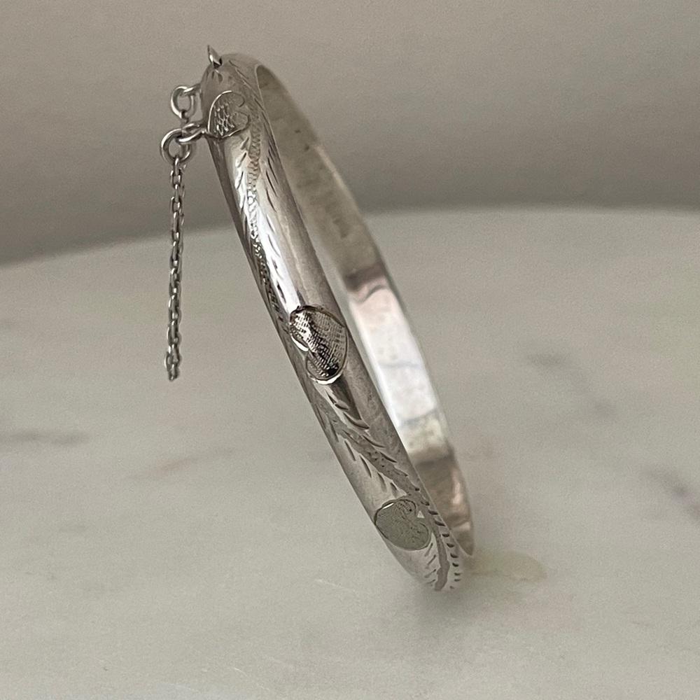 Vintage sterling engraved hearts.